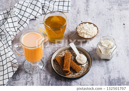 Protein nutrition and green tea for skin microbiome care set on the table 132501707