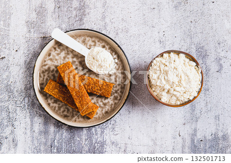 Protein bars and protein powder for clean eating top view Protein bars and protein powder for clean eating top view 132501713