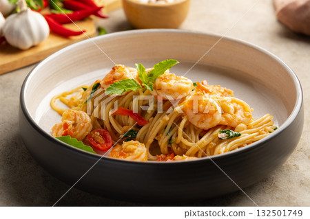 Spicy Stir Fried pasta seafood,Thai Spicy stir fried spaghetti with shrimp and basil leaves,Pad Kra Pao kung.Thai fusion food. 132501749