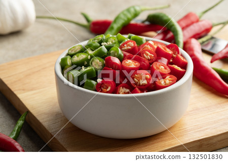 Sliced Red Chilli and green Chili Pepper in a bowl.(Thai Chili Jinda) Sliced Red Chilli and green Chili Pepper in a bowl.(Thai Chili Jinda) 132501830