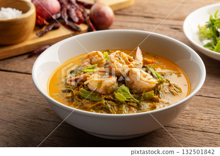 Tamarind Leaf Curry,Coconut Milk Curry with young Tamarind Leaves yardlong bean and shrimp in a bowl.Thai traditional food 132501842