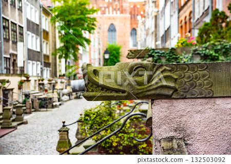Captivating view of intricate wrought iron railings set against the historic red brick buildings in Gdansk Old Town. The architectural detail reflects the city's rich history Captivating view of intricate wrought iron railings set against the historic red brick buildings in Gdansk Old Town. The architectural detail reflects the city's rich history 132503092