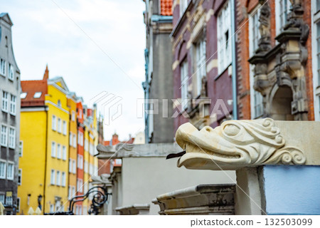 Captivating view of intricate wrought iron railings set against the historic red brick buildings in Gdansk Old Town. The architectural detail reflects the city's rich history Captivating view of intricate wrought iron railings set against the historic red brick buildings in Gdansk Old Town. The architectural detail reflects the city's rich history 132503099