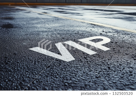 Exclusive VIP parking space on wet urban asphalt with raindrops 132503520