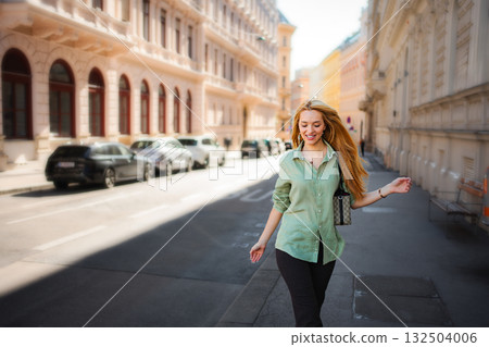 Happy woman enjoying walking experience on Vienna street Happy woman enjoying walking experience on Vienna street 132504006