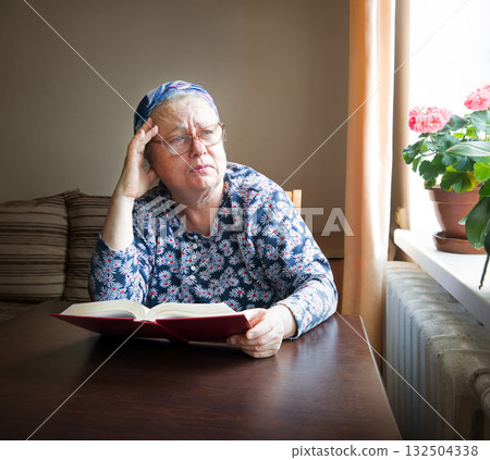 Old woman with big bpook 132504338