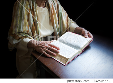 Old man reading a big book 132504339