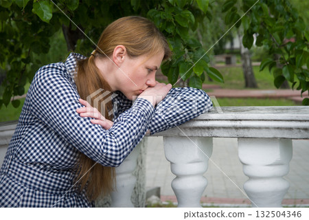 Sad girl in the park 132504346