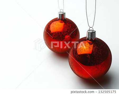 Two shiny red christmas ornaments with glitter detail 132505175