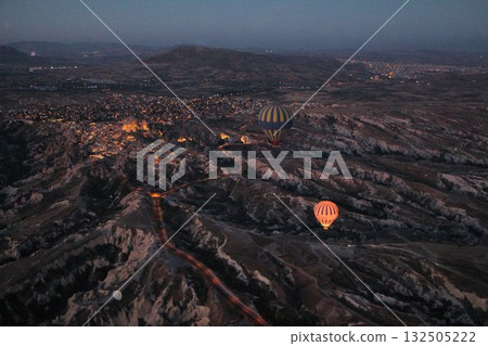 Cappadocia balloons flying from early morning before dawn to sunrise, Cappadocia scenery Cappadocia balloons flying from early morning before dawn to sunrise, Cappadocia scenery 132505222