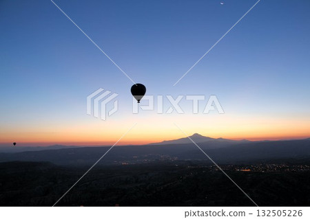 Cappadocia balloons flying from early morning before dawn to sunrise, Cappadocia scenery Cappadocia balloons flying from early morning before dawn to sunrise, Cappadocia scenery 132505226