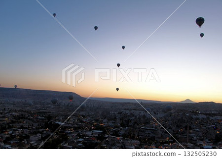 Cappadocia balloons flying from early morning before dawn to sunrise, Cappadocia scenery 132505230