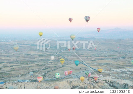 Cappadocia balloons flying from early morning before dawn to sunrise, Cappadocia scenery Cappadocia balloons flying from early morning before dawn to sunrise, Cappadocia scenery 132505248