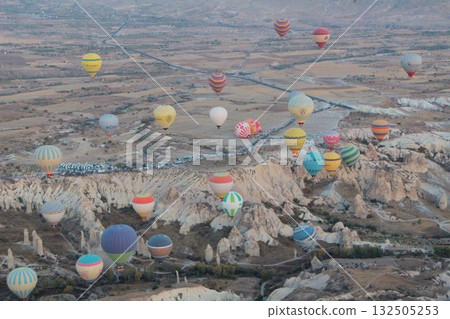 Cappadocia balloons flying from early morning before dawn to sunrise, Cappadocia scenery Cappadocia balloons flying from early morning before dawn to sunrise, Cappadocia scenery 132505253