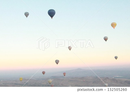 Cappadocia balloons flying from early morning before dawn to sunrise, Cappadocia scenery 132505260