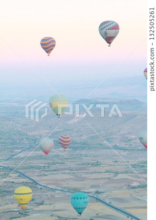 Cappadocia balloons flying from early morning before dawn to sunrise, Cappadocia scenery Cappadocia balloons flying from early morning before dawn to sunrise, Cappadocia scenery 132505261