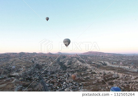Cappadocia balloons flying from early morning before dawn to sunrise, Cappadocia scenery Cappadocia balloons flying from early morning before dawn to sunrise, Cappadocia scenery 132505264