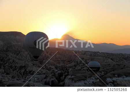 Cappadocia balloons flying from early morning before dawn to sunrise, Cappadocia scenery Cappadocia balloons flying from early morning before dawn to sunrise, Cappadocia scenery 132505268