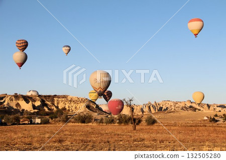 Cappadocia balloons flying from early morning before dawn to sunrise, Cappadocia scenery Cappadocia balloons flying from early morning before dawn to sunrise, Cappadocia scenery 132505280