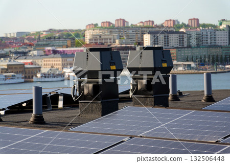 Solar panels on roof of apartment building, renewable green sustainable energy concept, water cooling, aerial view, Gothenburg, Sweden Solar panels on roof of apartment building, renewable green sustainable energy concept, water cooling, aerial view, Gothenburg, Sweden 132506448