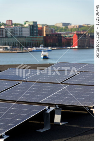 Solar panels on roof of apartment building, renewable green sustainable energy concept, water cooling, aerial view, Gothenburg, Sweden Solar panels on roof of apartment building, renewable green sustainable energy concept, water cooling, aerial view, Gothenburg, Sweden 132506449