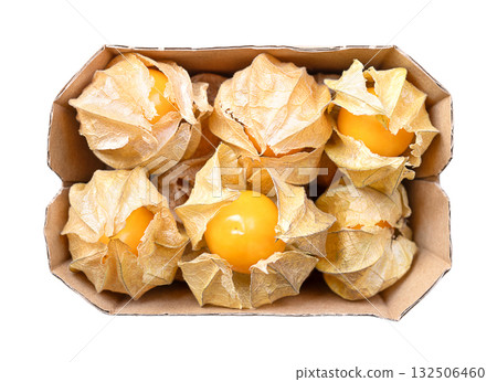 Goldenberries, groundcherries in a fruit carton, from above. Ripe, fresh Physalis peruviana, bright orange fruits, with papery husks, also called poha, cape gooseberries, Peruvian groundcherry, etc. 132506460