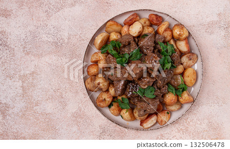 kuyrdak, roast offal with potatoes and fresh herbs, homemade in Kazakh, no people, 132506478