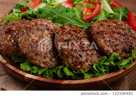 Fried cutlets, mixed minced meat, with vegetable salad, homemade, top view, no people, Fried cutlets, mixed minced meat, with vegetable salad, homemade, top view, no people, 132506485