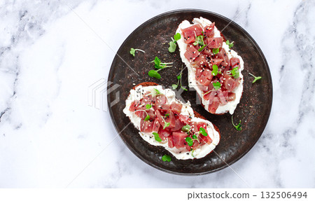 sandwiches, rye bread with cream cheese, sliced tuna fillet with herbs, breakfast on a black plate, homemade, sandwiches, rye bread with cream cheese, sliced tuna fillet with herbs, breakfast on a black plate, homemade, 132506494