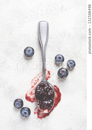 a spoon with blueberry jam, on a white table, breakfast, top view, homemade, no people, a spoon with blueberry jam, on a white table, breakfast, top view, homemade, no people, 132506496