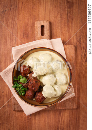 Swedish meatballs in cream sauce, plate on a wooden table, homemade, no people, Swedish meatballs in cream sauce, plate on a wooden table, homemade, no people, 132506497