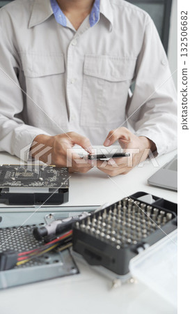 Closeup hand of computer hardware technician dissemble and  fixing computer PC. 132506682