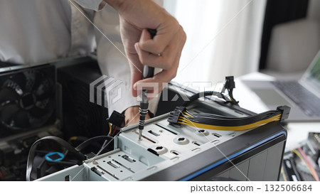 Closeup hand of computer hardware technician dissemble and  fixing computer PC. 132506684