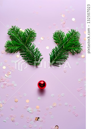 Christmas background in decoration in the shape of deer horns and a red nose. Christmas background in decoration in the shape of deer horns and a red nose. 132507023