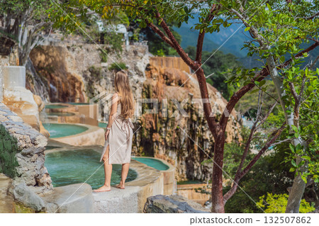 Female tourist exploring Grutas Tolantongo in Mexico, enjoying natural hot springs, scenic caves, and outdoor adventure. Travel, wellness, and sightseeing concept Female tourist exploring Grutas Tolantongo in Mexico, enjoying natural hot springs, scenic caves, and outdoor adventure. Travel, wellness, and sightseeing concept 132507862