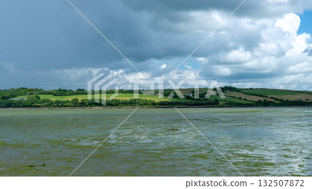 A tranquil bay under a heavy sky. A tranquil bay under a heavy sky. 132507872