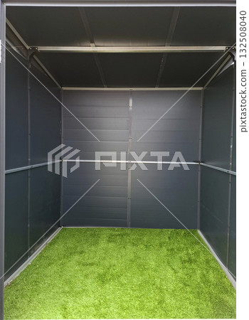 Inside a small plastic house, the view reveals a grassy area. The walls are smooth and dark, creating a cozy enclosure, ideal for children to play or relax. Inside a small plastic house, the view reveals a grassy area. The walls are smooth and dark, creating a cozy enclosure, ideal for children to play or relax. 132508040