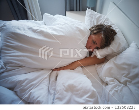 Lonely 35 year old woman sleeping alone after breakup, sadness and emotional emptiness Lonely 35 year old woman sleeping alone after breakup, sadness and emotional emptiness 132508225