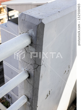 Cracked grey concrete wall surface, Rust in reinforcement of Concrete fence, Broken or weak concrete. 132508403