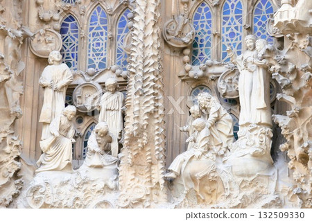 Detail of the sculpture at the top of the "Porta de Charity" in the center of the Sagrada Familia's "Nativity Facade" Detail of the sculpture at the top of the "Porta de Charity" in the center of the Sagrada Familia's "Nativity Facade" 132509330