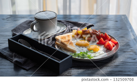 Fried eggs served in a cafe. Fried eggs served in a cafe. 132509708