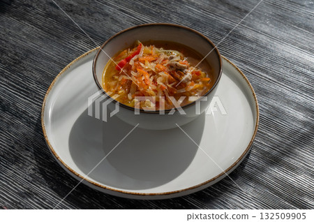 A bowl of shchi soup in a cafe.  132509905