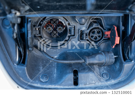 Close-up of an electric vehicle charging port.  132510001