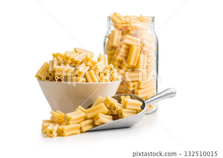 Cinque buchi. Uncooked italian pasta in scoop isolated on white background. Cinque buchi. Uncooked italian pasta in scoop isolated on white background. 132510015