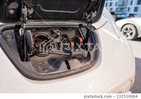 Close-up of an electric vehicle charging port.  132510064