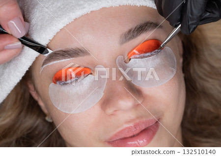 The process of professional lamination and dyeing of eyelashes and eyebrows in the salon. Four-handed procedure. The process of professional lamination and dyeing of eyelashes and eyebrows in the salon. Four-handed procedure. 132510140