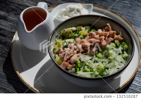 Okroshka with chicken on kvass in a cafe. Okroshka with chicken on kvass in a cafe. 132510287