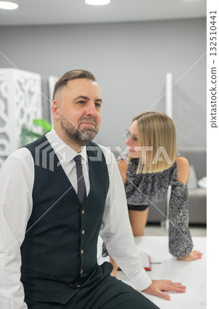 Colleagues fooling around at work in the office. Colleagues fooling around at work in the office. 132510441