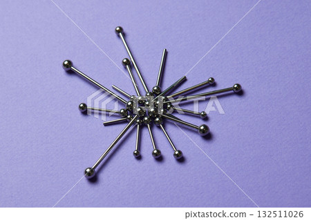 Piercing earrings close-up. On a Violet background. Piercing earrings close-up. On a Violet background. 132511026