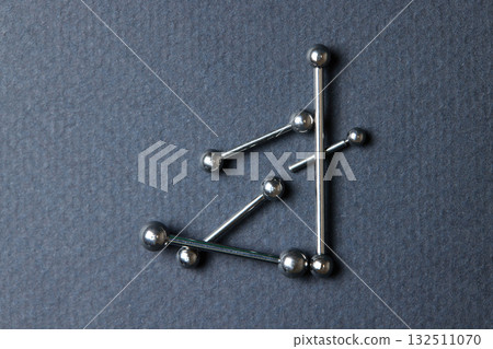 Piercing earrings close-up. On a black background. Piercing earrings close-up. On a black background. 132511070